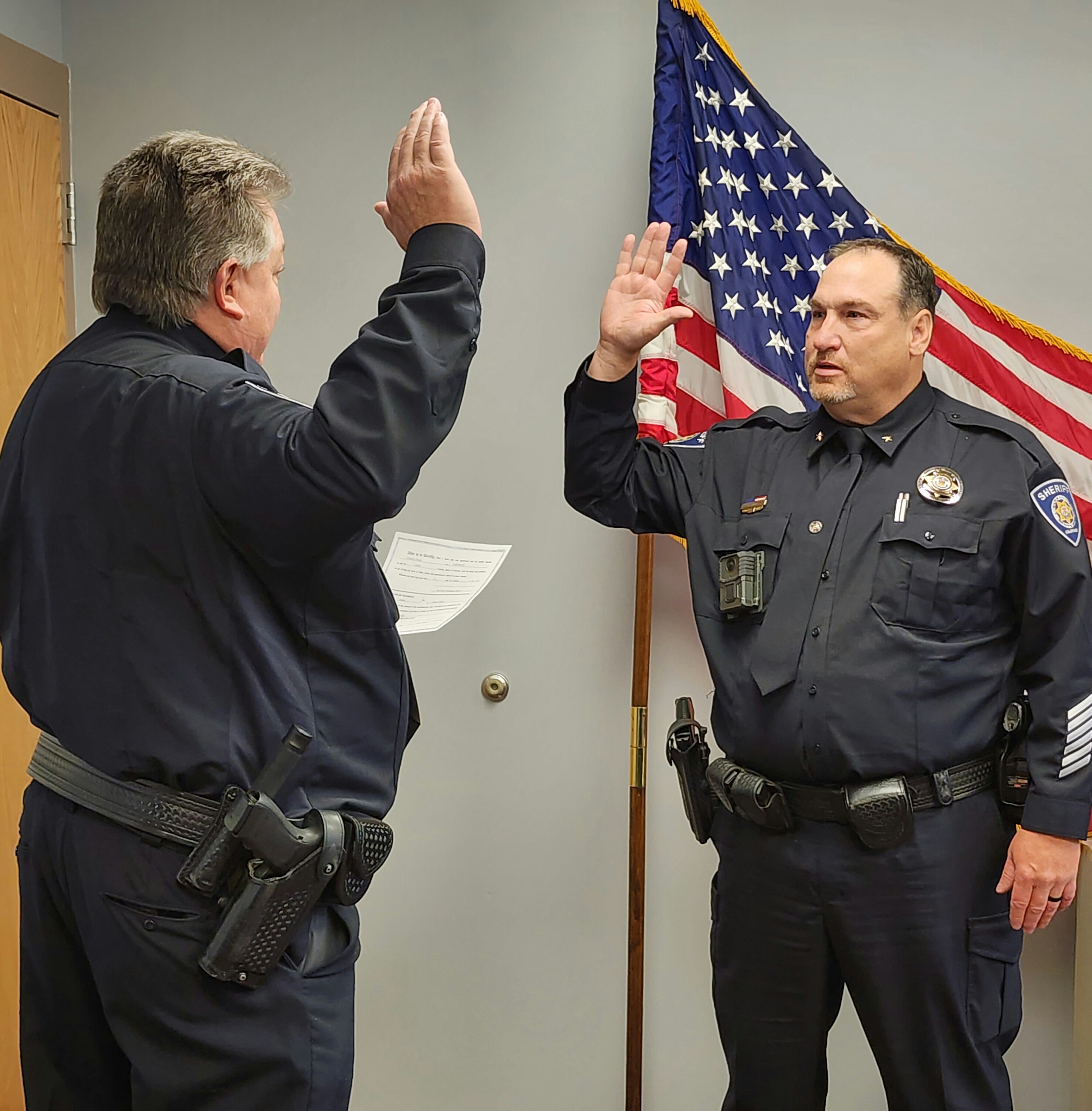 Sheriff Armstrong swearing in Undersheriff Demo